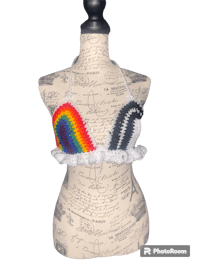 a mannequin wearing a rainbow crochet bikini top