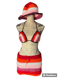 a crocheted bikini and hat on a mannequin