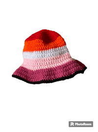 a crocheted hat on a black background