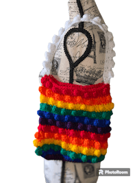 a crocheted rainbow bag on a mannequin mannequin